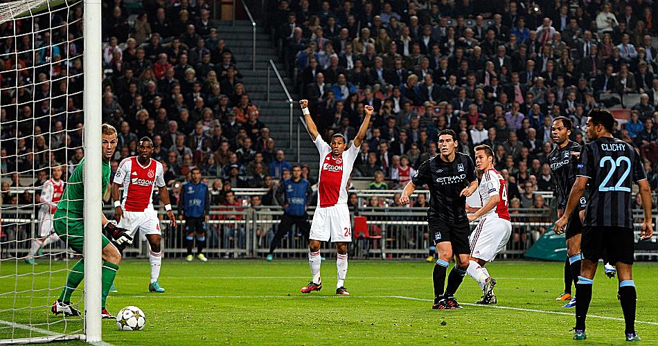 Joe Hart and the Manchester City defence can only watch as Ajax's Nicklas Moisander puts the Dutch side ahead on route to a 3-1 victory.