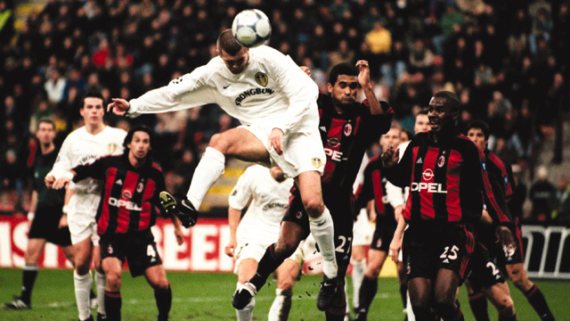 Leeds United's Dominic Matteo heads home at the San Siro to send David O'Leary's men through at the Rossoneri's expense
