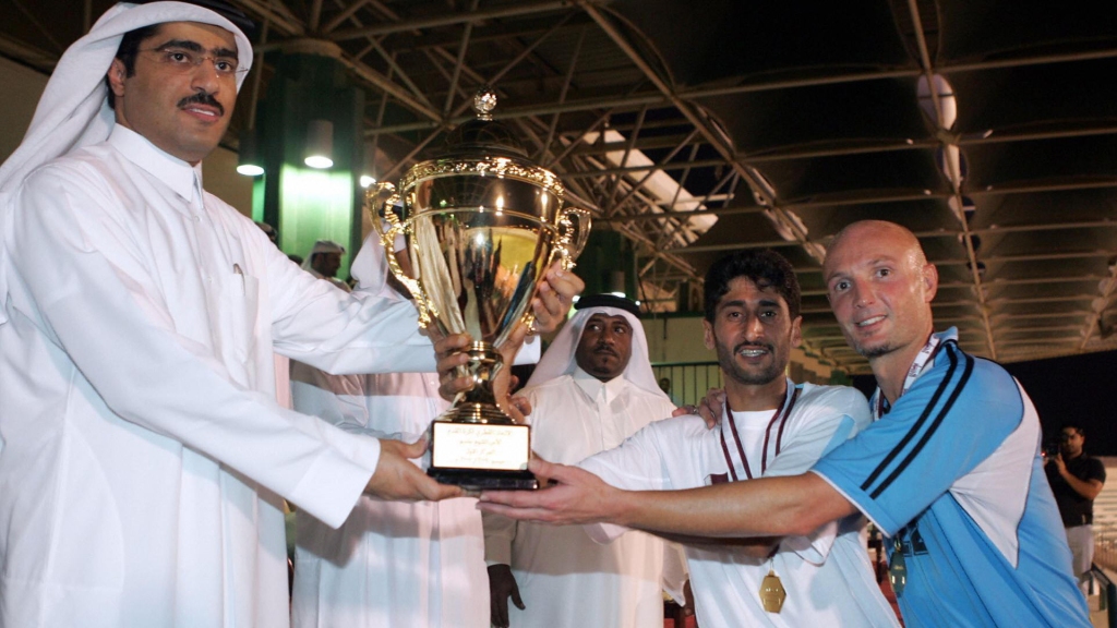 qatars-al-wakra-club-players-french-soccer-star-frank-leboeuf-and-jassem-al-tamimi-receive-the-sheikh-jassem-cup-from-sheikh-jassem-bin-thamer-al-thani_66qzpq4v12hl1xka8zwvdq3bh