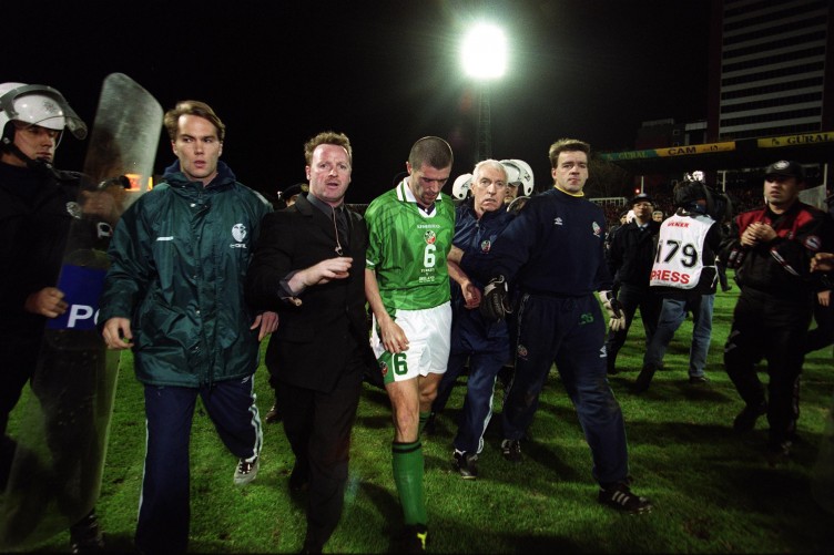 Ireland captain Roy Keane is led off the pitch by officials and security personnel after away goals defeat to Turkey.